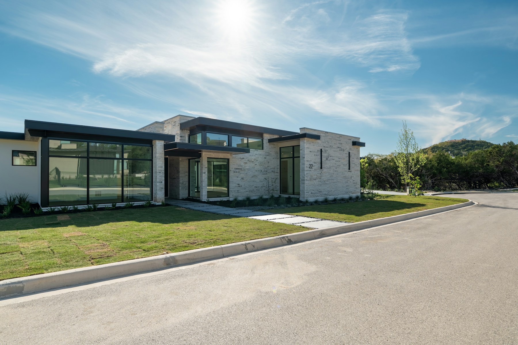 Contemporary stone residence set within a landscaped site